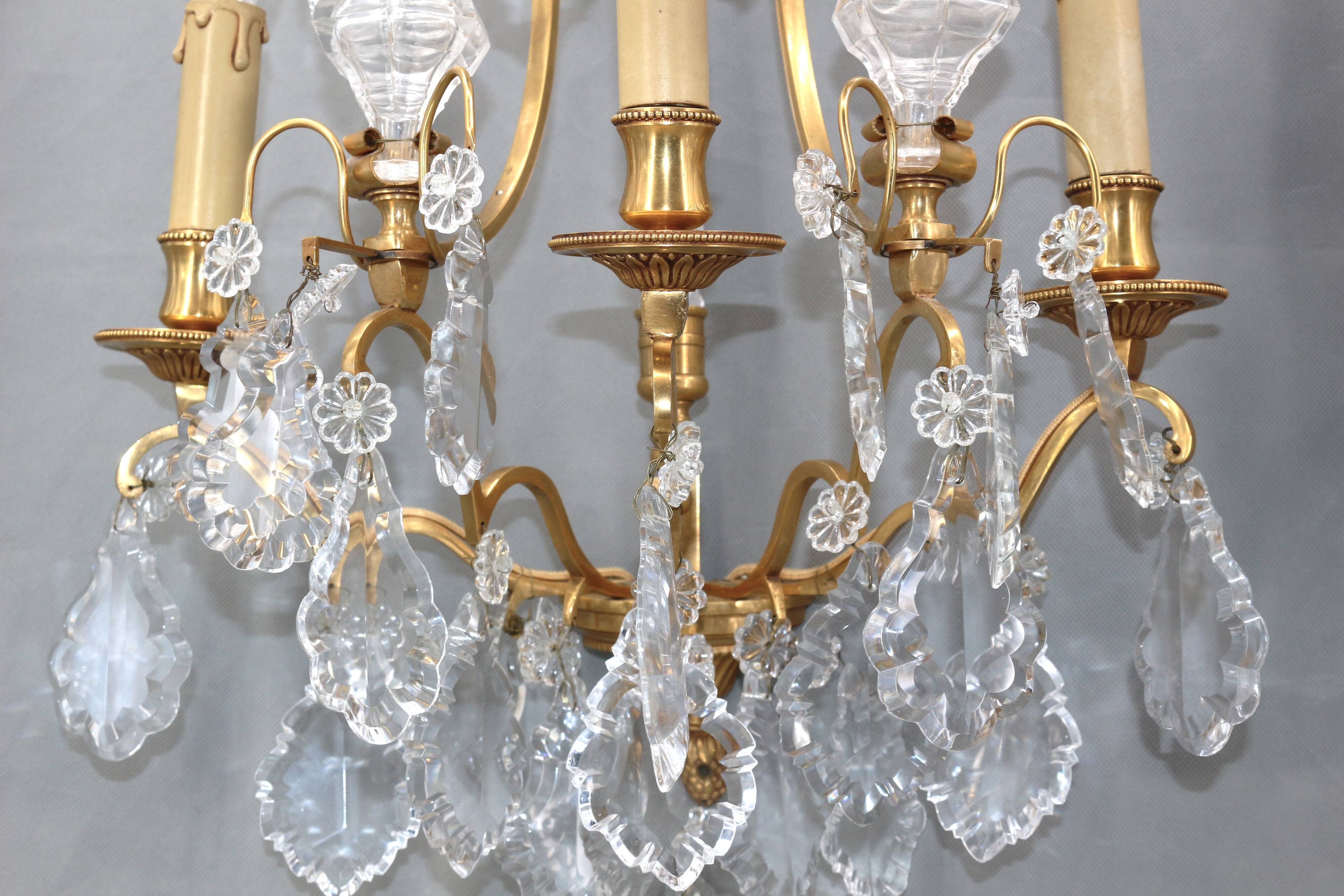 Pair of Louis XVI style gilded bronze & bohemian crystal sconces