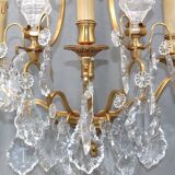 Pair of Louis XVI style gilded bronze & bohemian crystal sconces