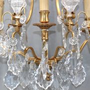 Pair of Louis XVI style gilded bronze & bohemian crystal sconces