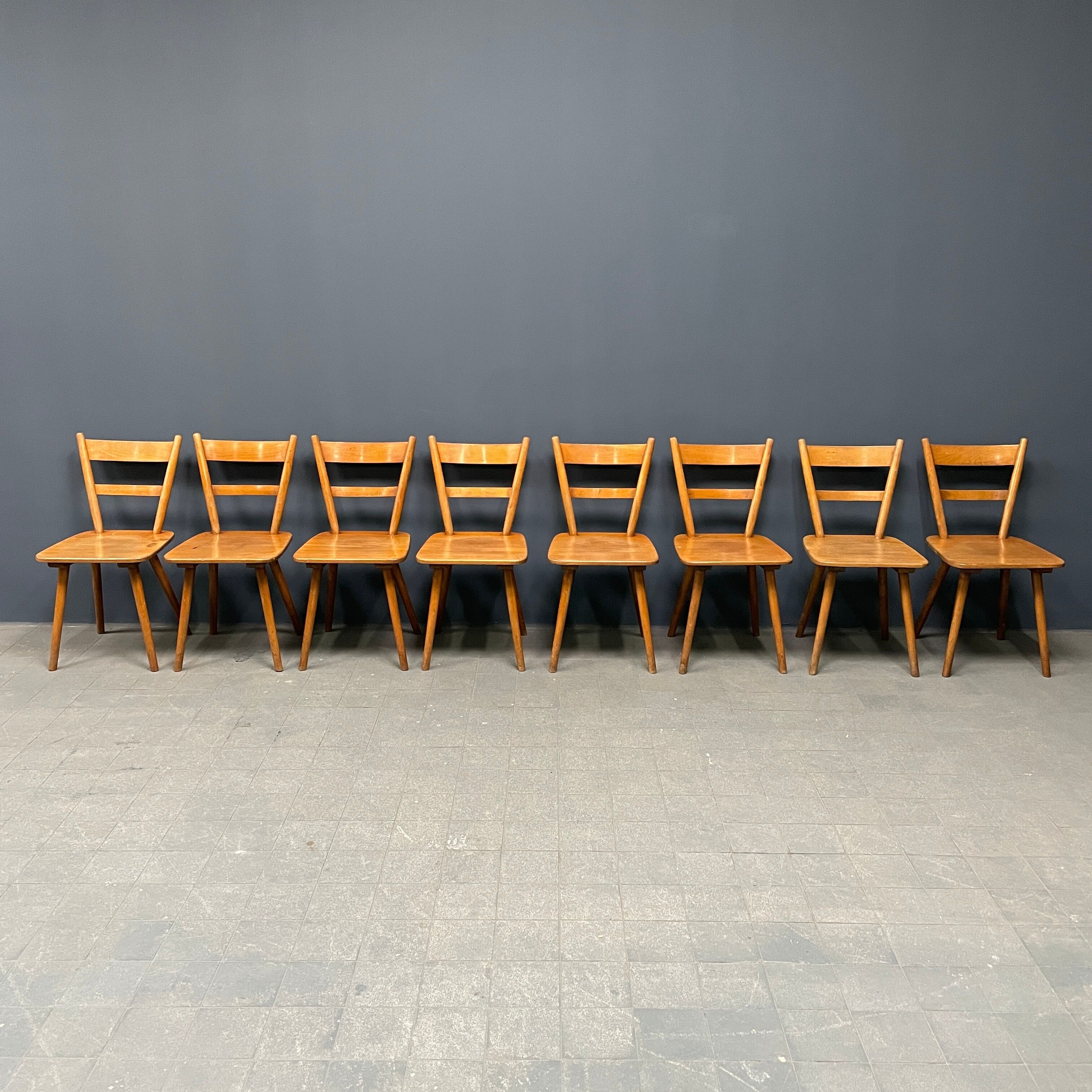 Set of eight german stick chairs from the 1950