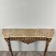 Louis XVI style console in carved wood with a gilded patina, 19th century.