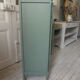 Vintage shoe cabinet smoked green wax finish, wooden top.