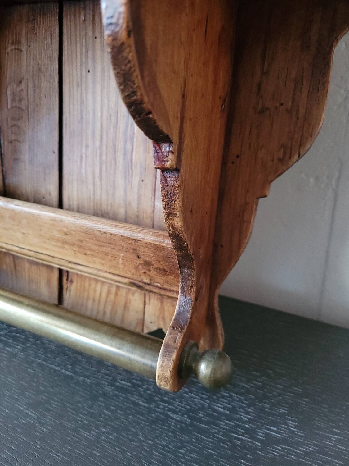 Small antique wall shelf with a drawer in light solid wood.