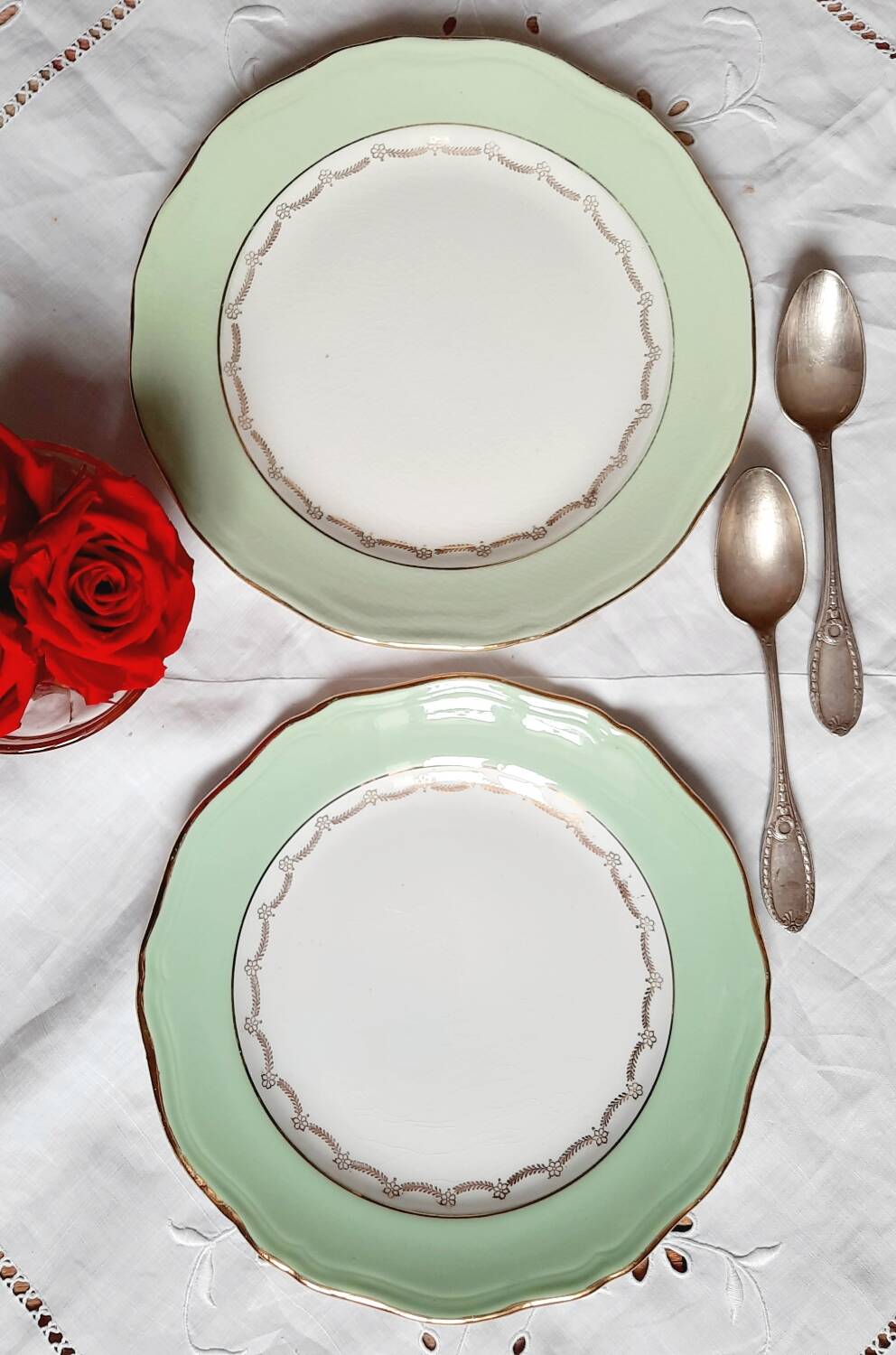 Old mismatched earthenware dessert plates with gold accompanied by a dish