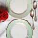 Old mismatched earthenware dessert plates with gold accompanied by a dish
