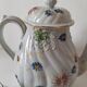 coffee pot, cup and saucers