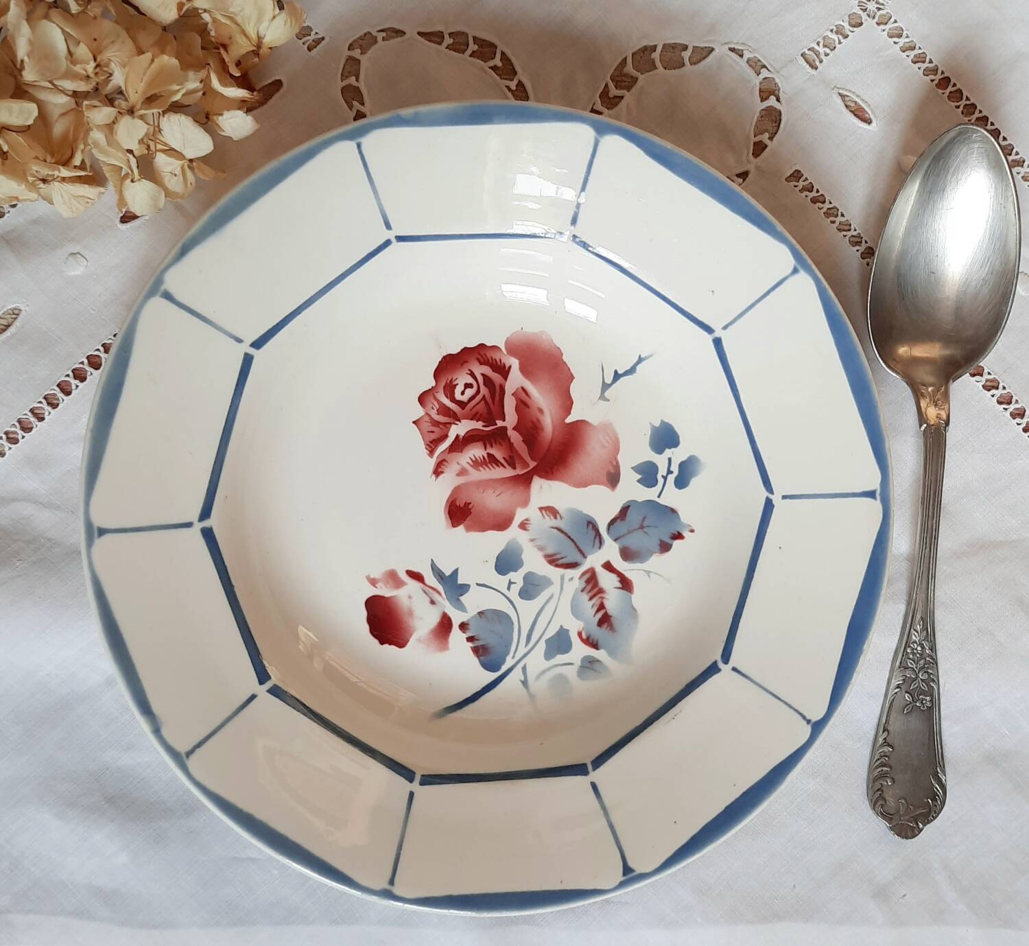 Mismatched old soup plates accompanied by a soup tureen