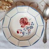 Mismatched old soup plates accompanied by a soup tureen