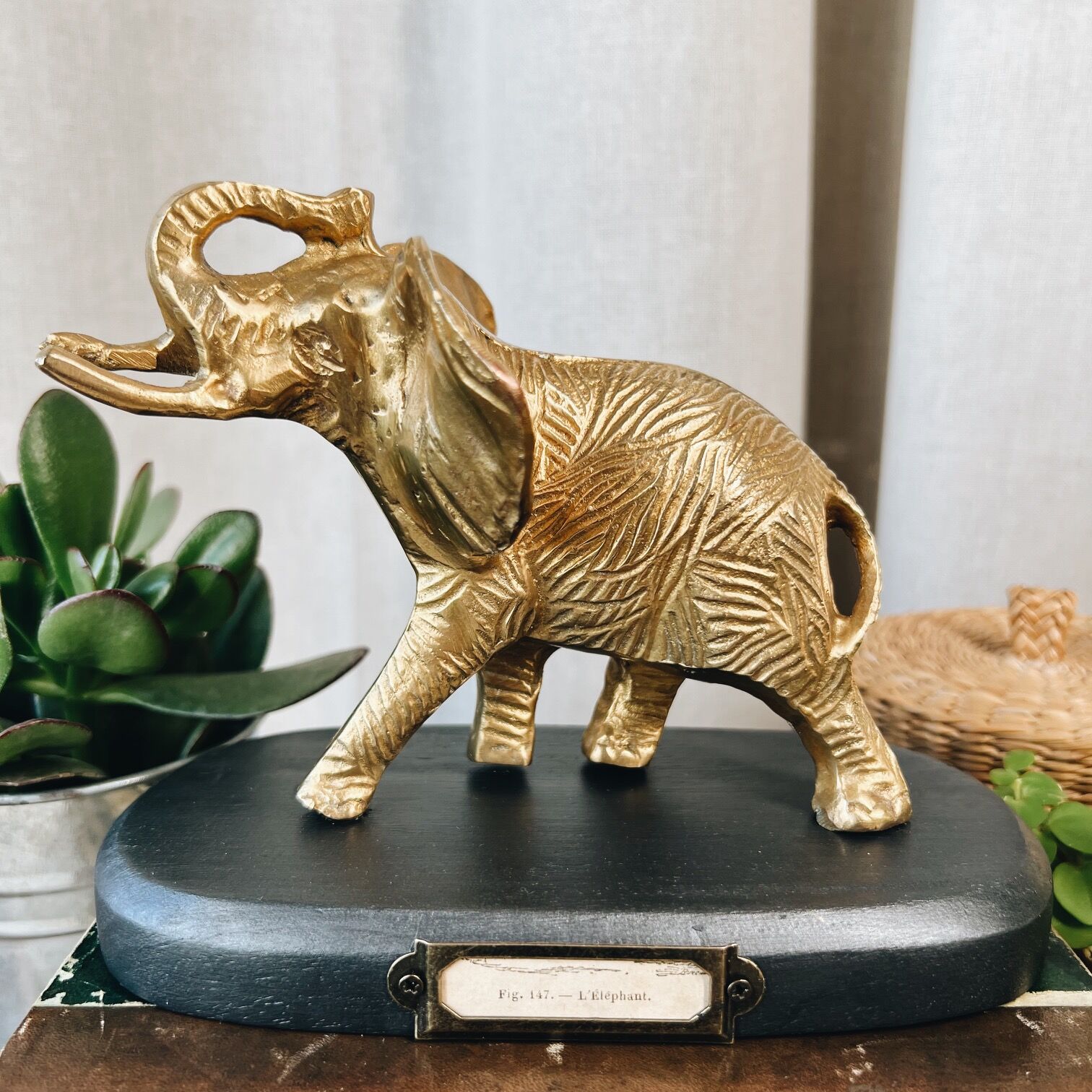 Bronze elephant on pedestal