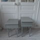 Duo of mismatched bedside tables green of gray