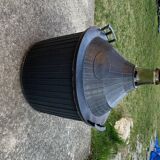 Dame-Jeanne vintage in olive green glass with a basket and black plastic lid.