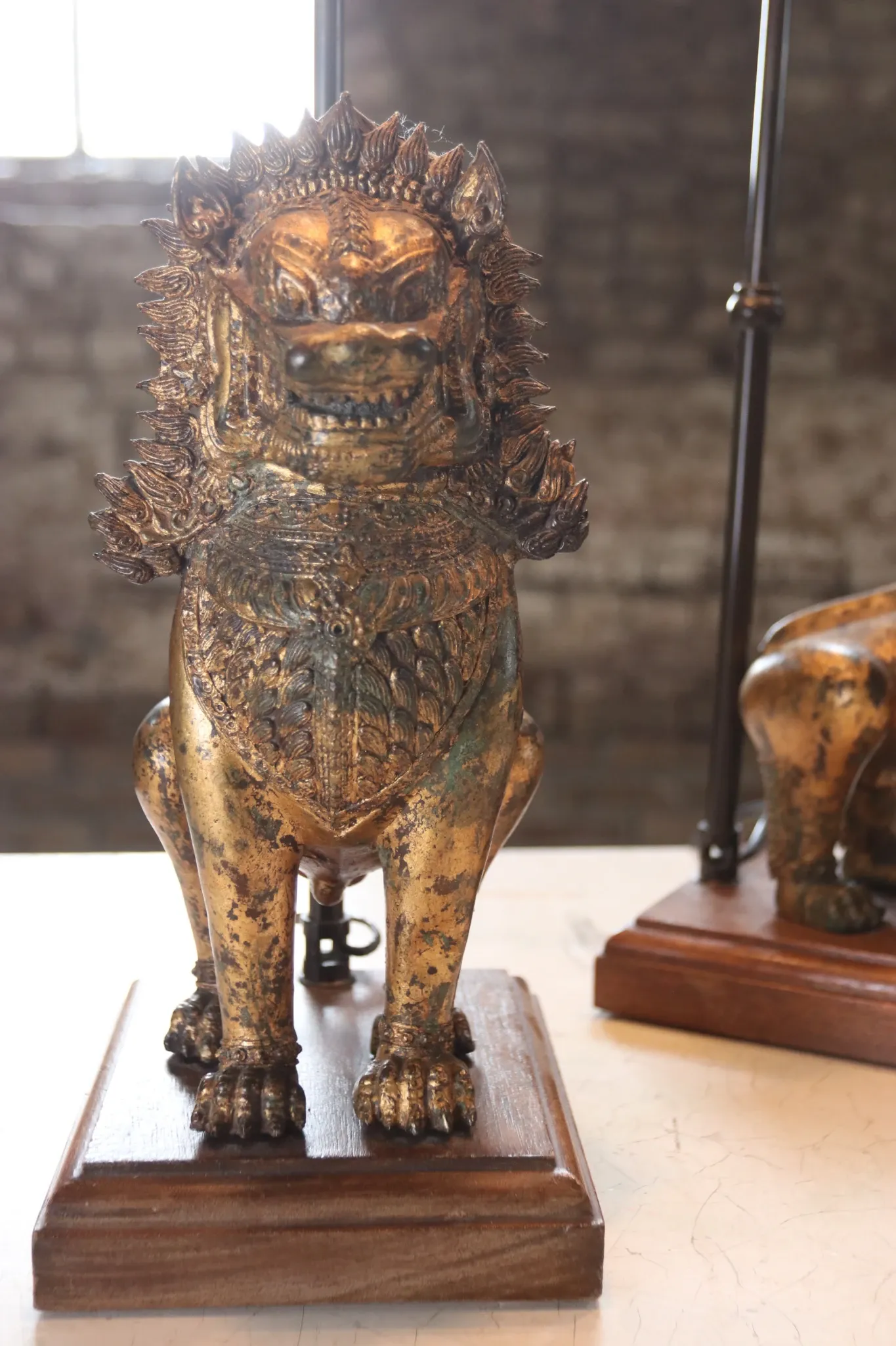 Pair of table lamps with gilt bronze Singha lions – Thailand, 1970s