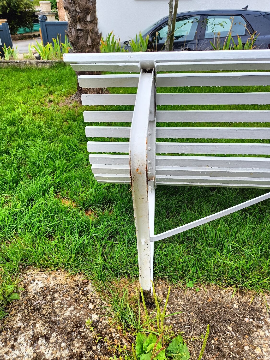 Antique garden bench with metal legs