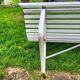 Antique garden bench with metal legs