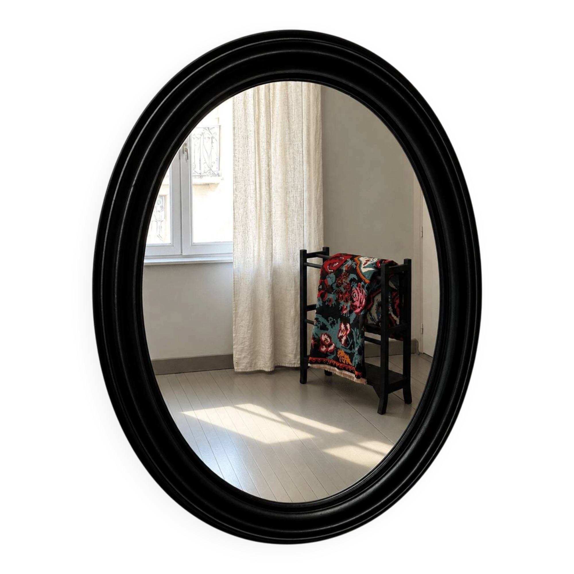 Antique oval mirror in patinated black wood