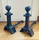 Pair of massive antique-style fire dogs in solid iron from the 20th century.
