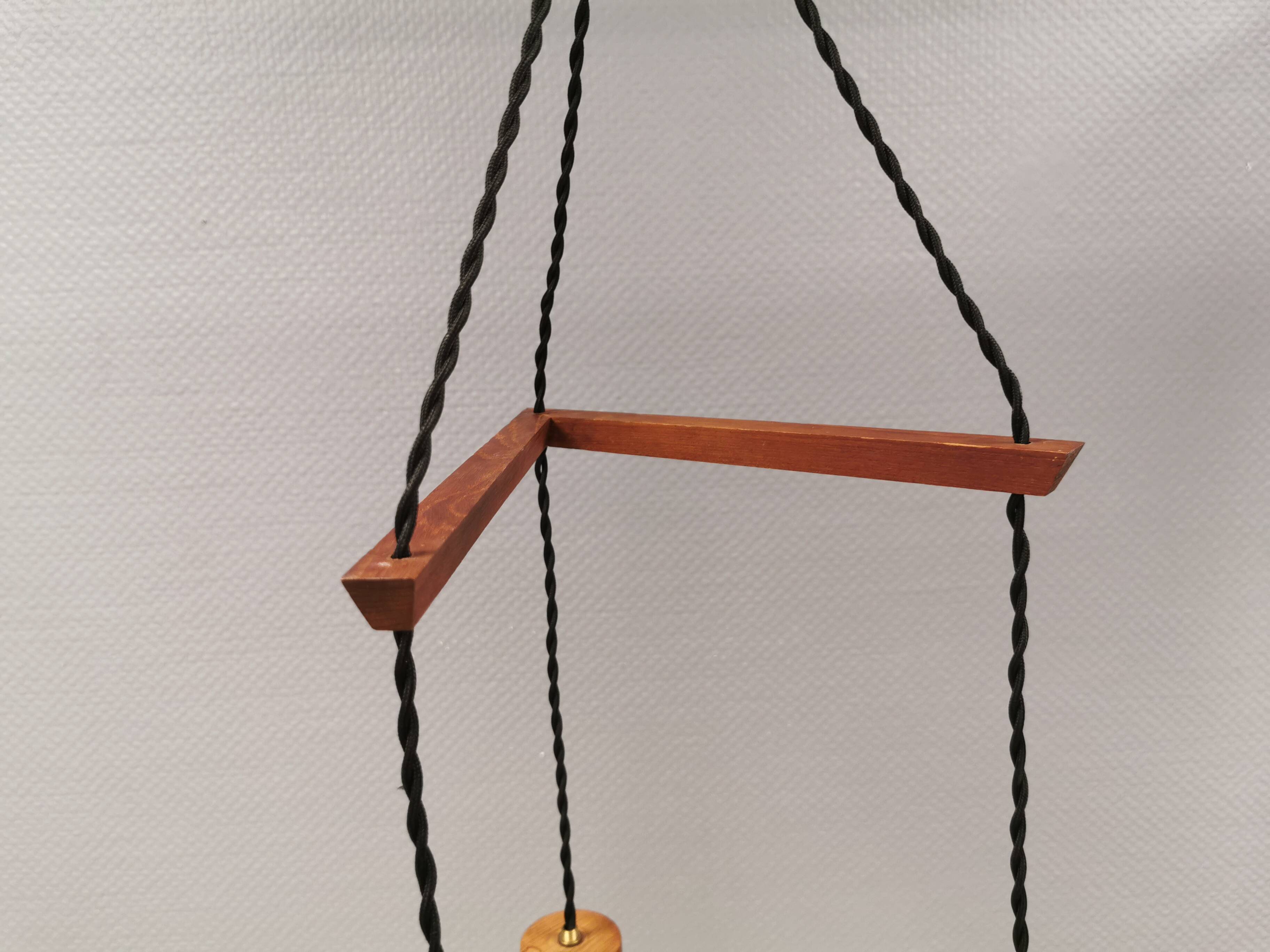 Three-part pendant in crystal glass, teak wood, and thin dusty green metal