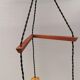 Three-part pendant in crystal glass, teak wood, and thin dusty green metal