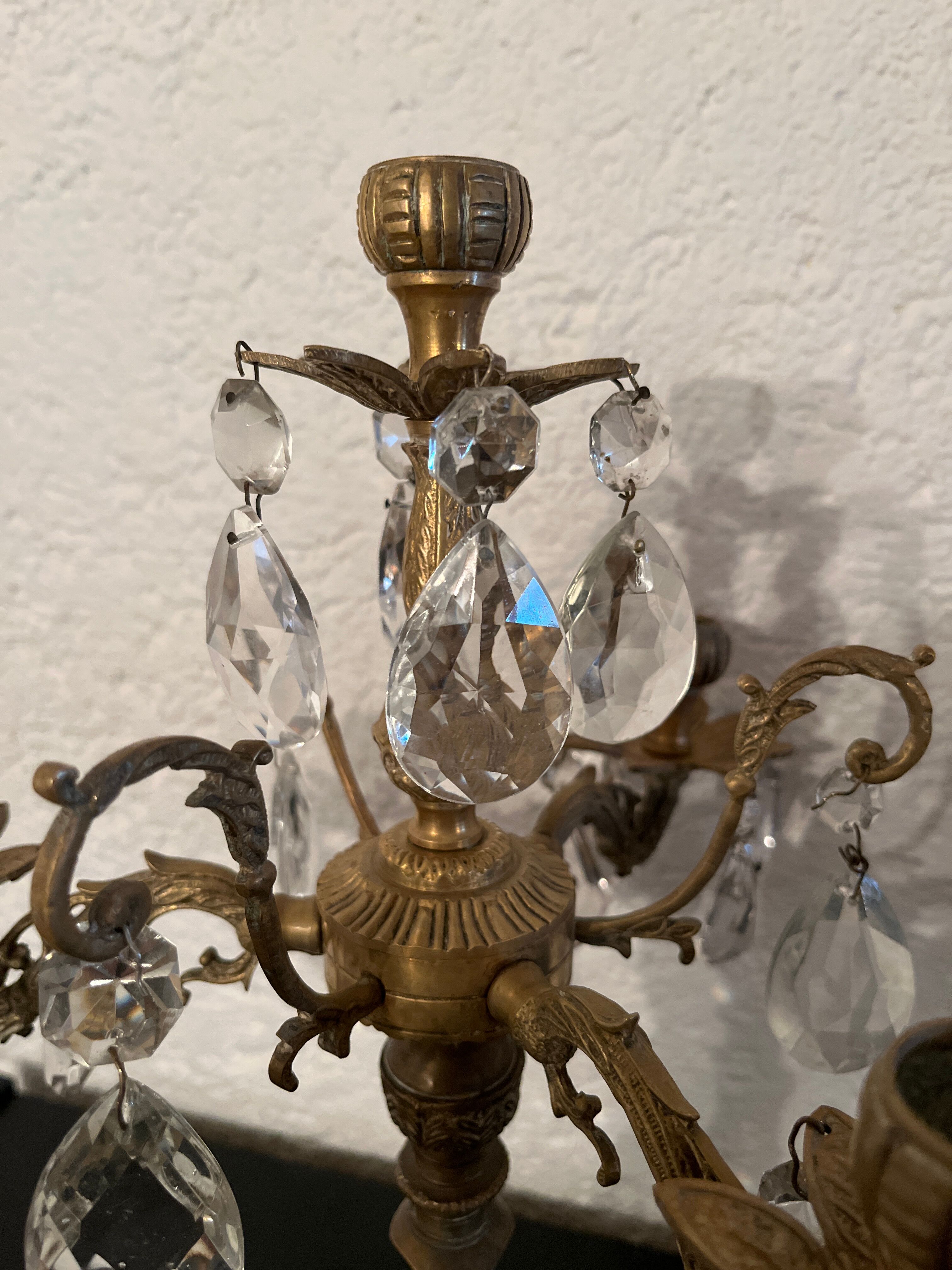 Duo of bronze chandeliers with tassels