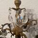 Duo of bronze chandeliers with tassels