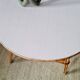 Round soft pink rattan table