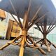 Vintage 1950s set: large table with tripod base and benches in woven chestnut
