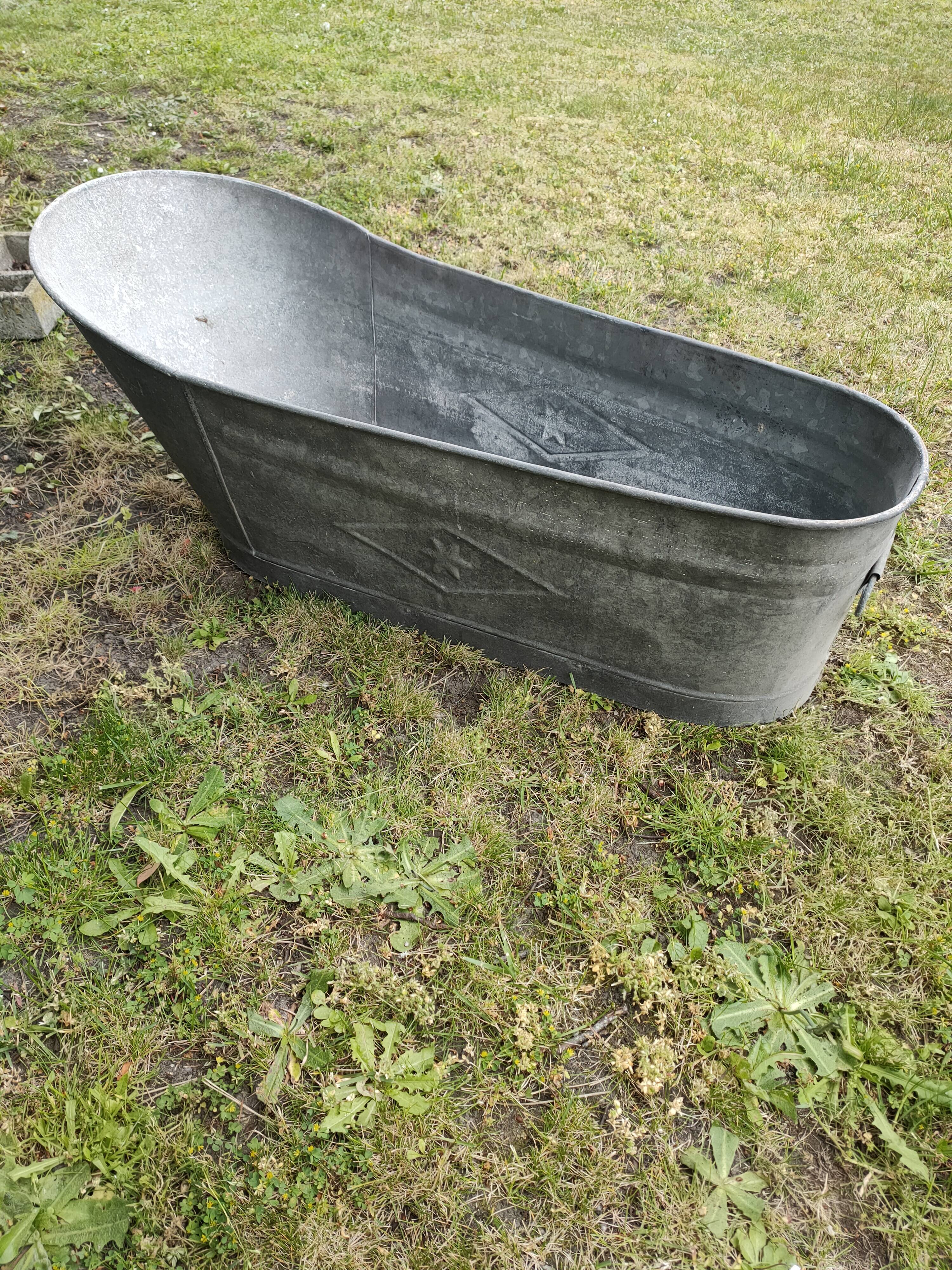 Antique children's bathtub in zinc