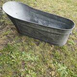 Antique children's bathtub in zinc