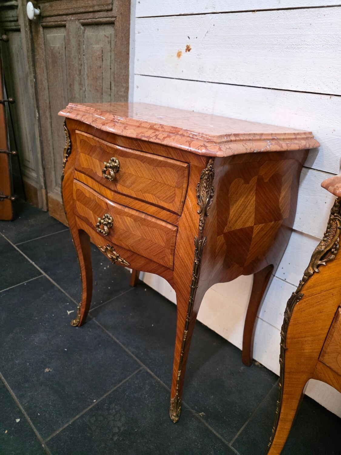 Pair of Louis XV style curved bedside tables in marquetry
