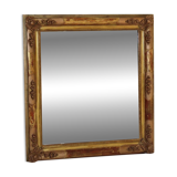 Rectangular mirror in gilded wood with relief decoration of flowers.