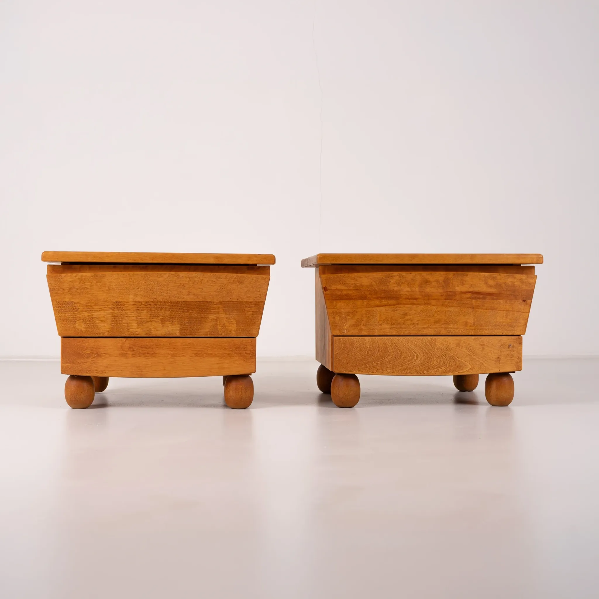 Pair of wooden bedside tables with rounded feet