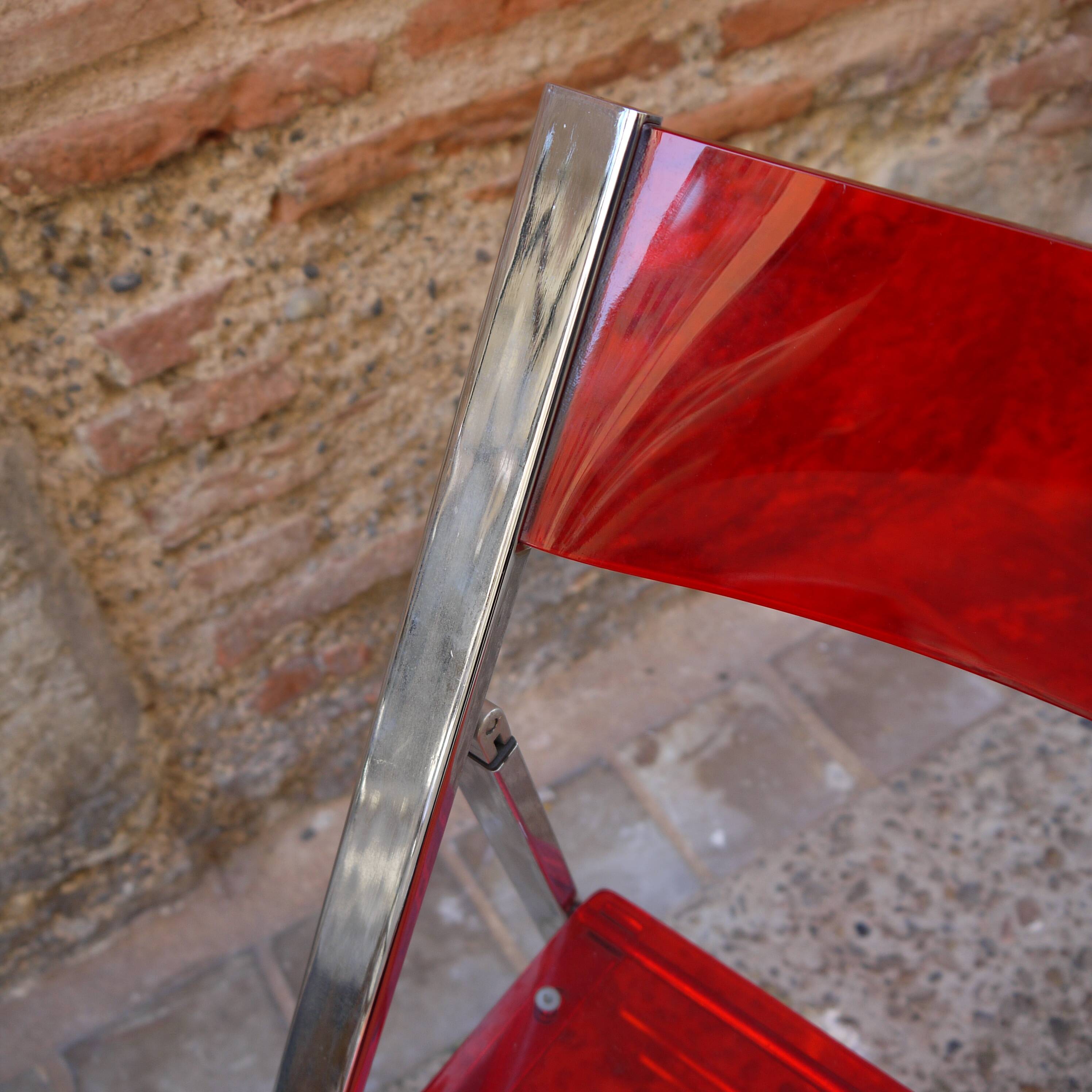 Red Plexiglas folding chair
