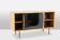Low ash sideboard with sliding doors. 1960s.