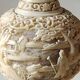 Asian-inspired ball vase. In beige cinnabar lacquer. Scenes of life decor. Arabesque and floral friezes. Height 24 cm