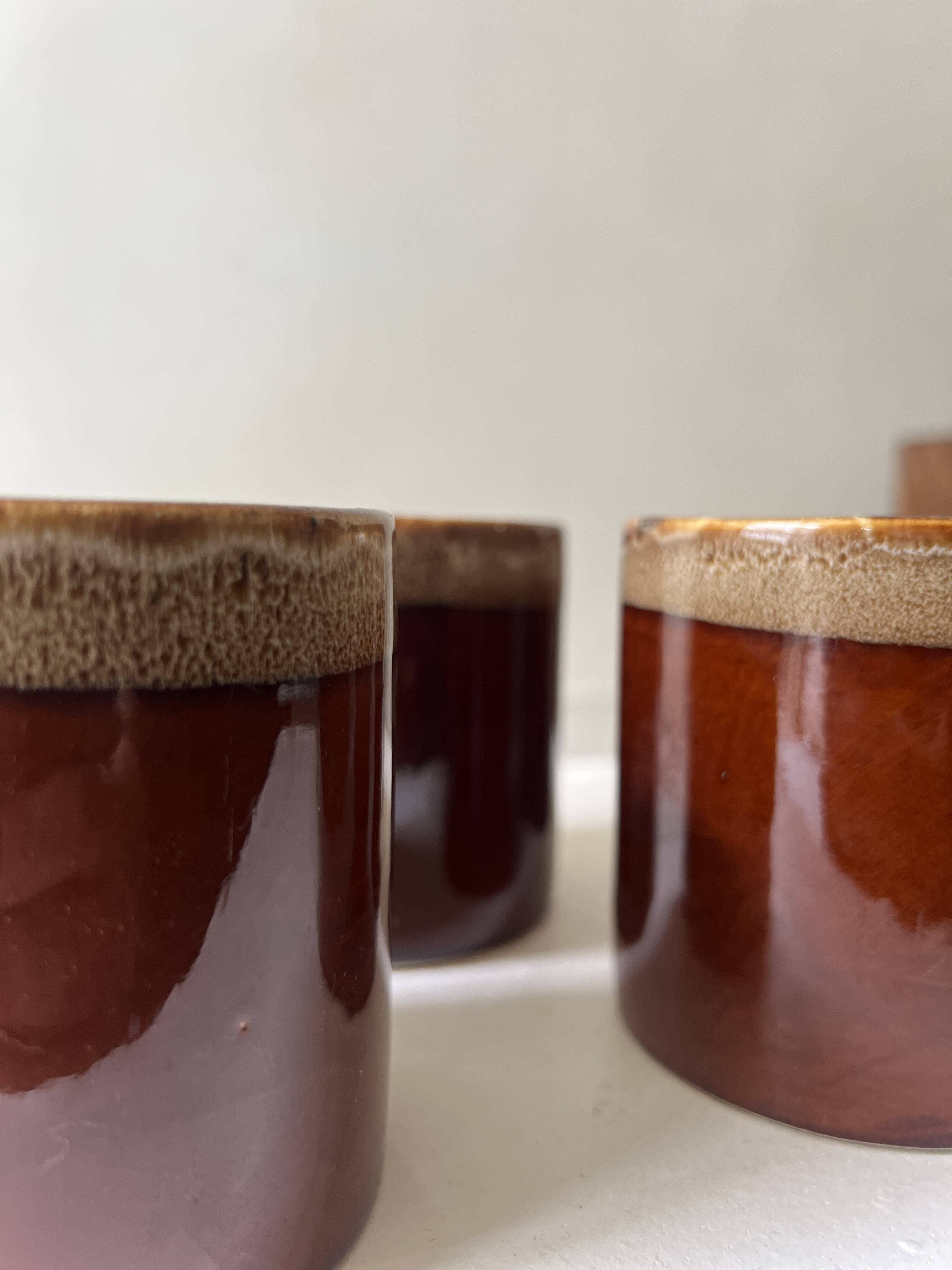 Service of 6 coffee cups in handcrafted glazed ceramic, amber brown, 1970.