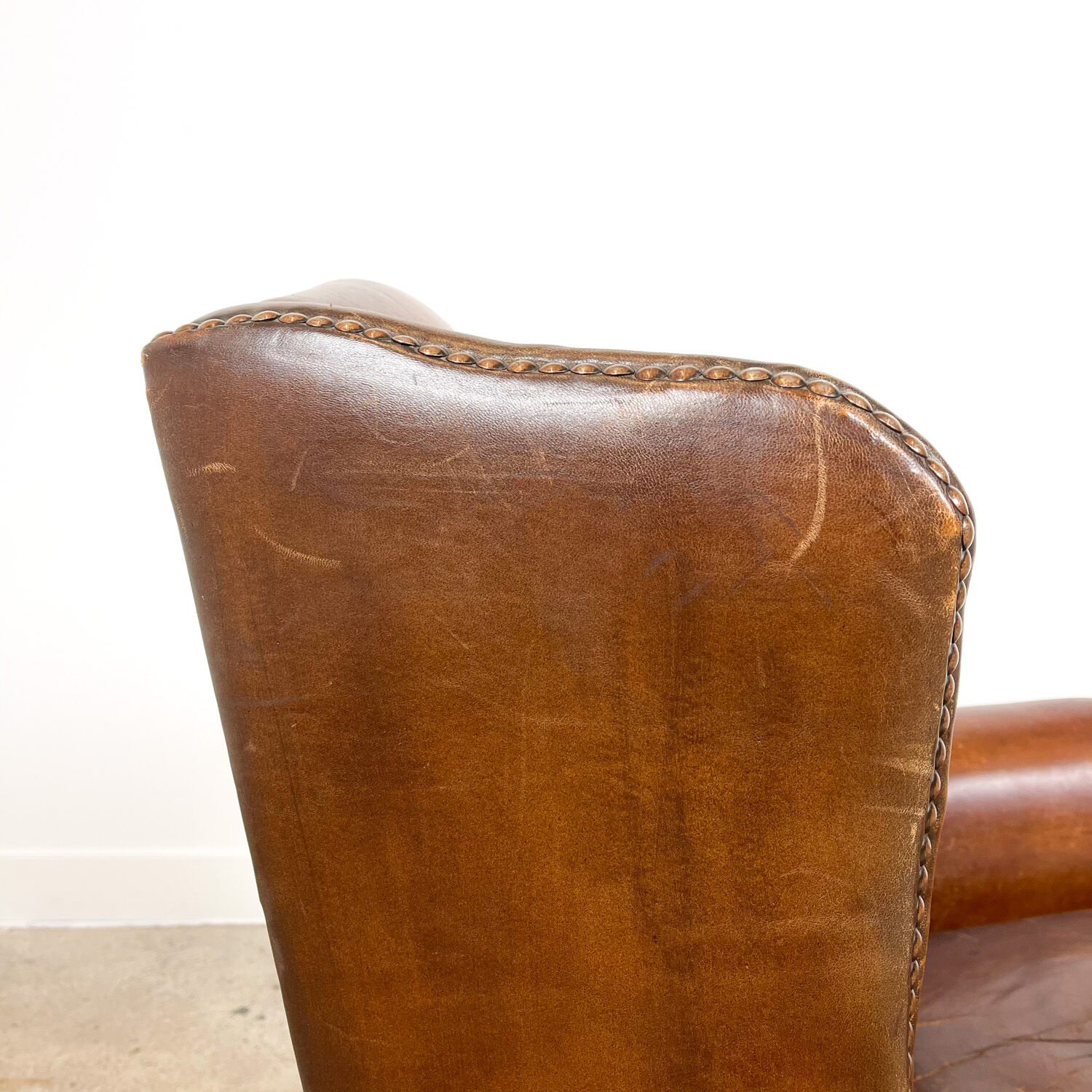 Dark brown sheep leather wingback armchair vintage