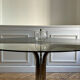 Table ronde en verre fumé et chrome