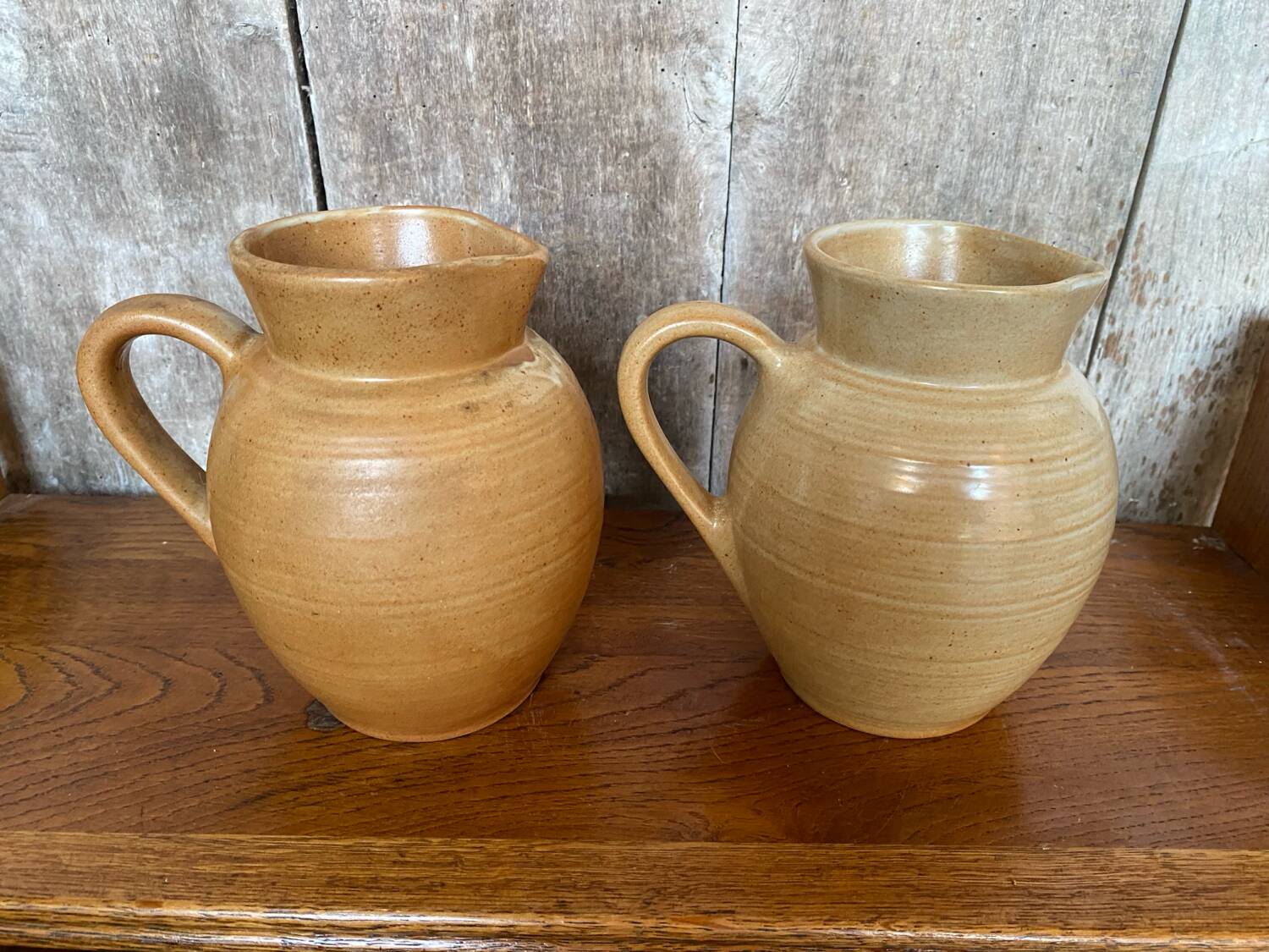 Pair antique cnp village beige & cream stoneware pitchers vintage