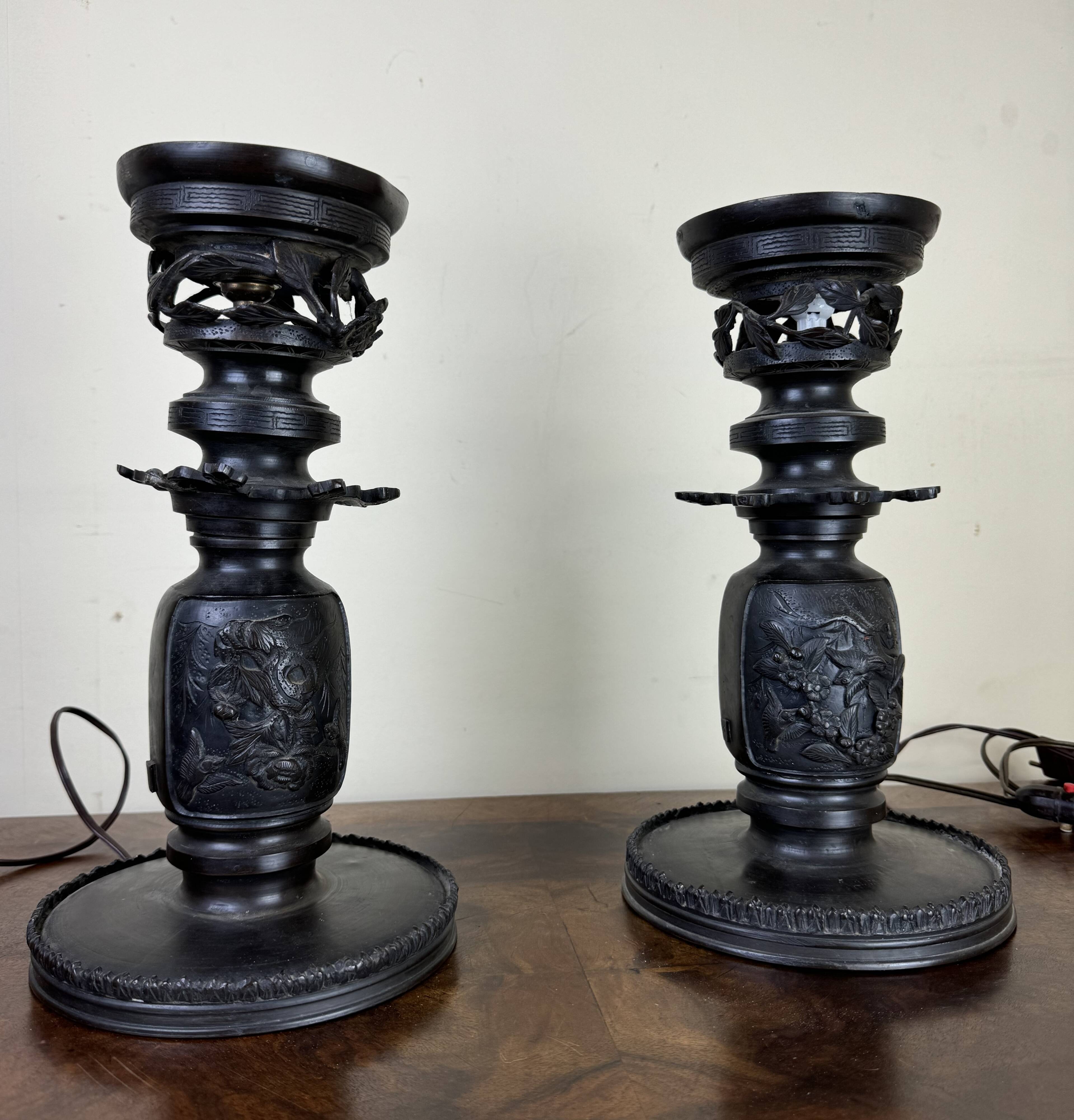 Japan Meiji period: Pair of patinated bronze candlesticks circa 1880