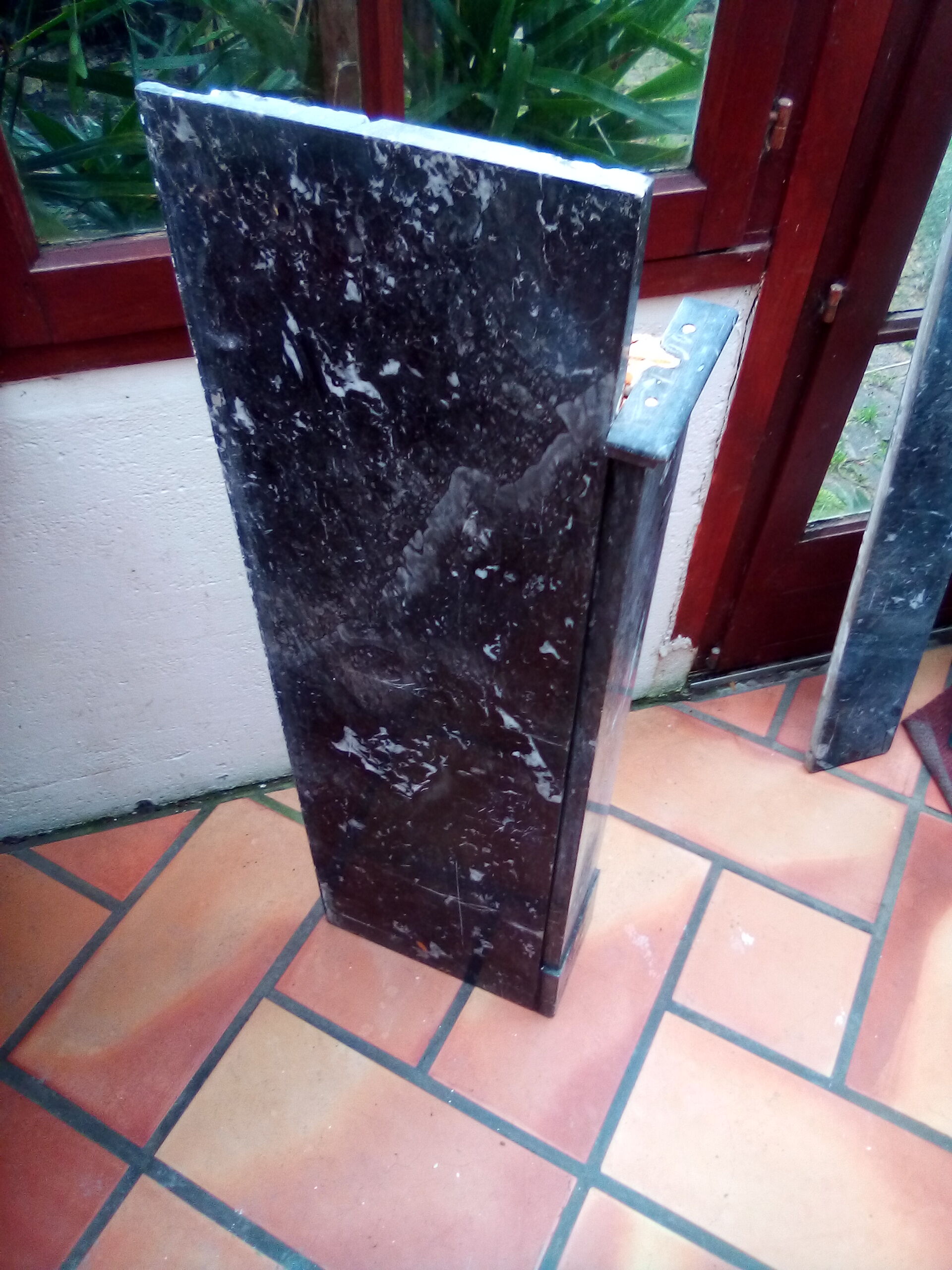 White veined black marble fireplace