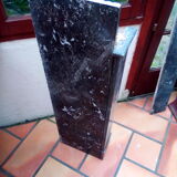 White veined black marble fireplace