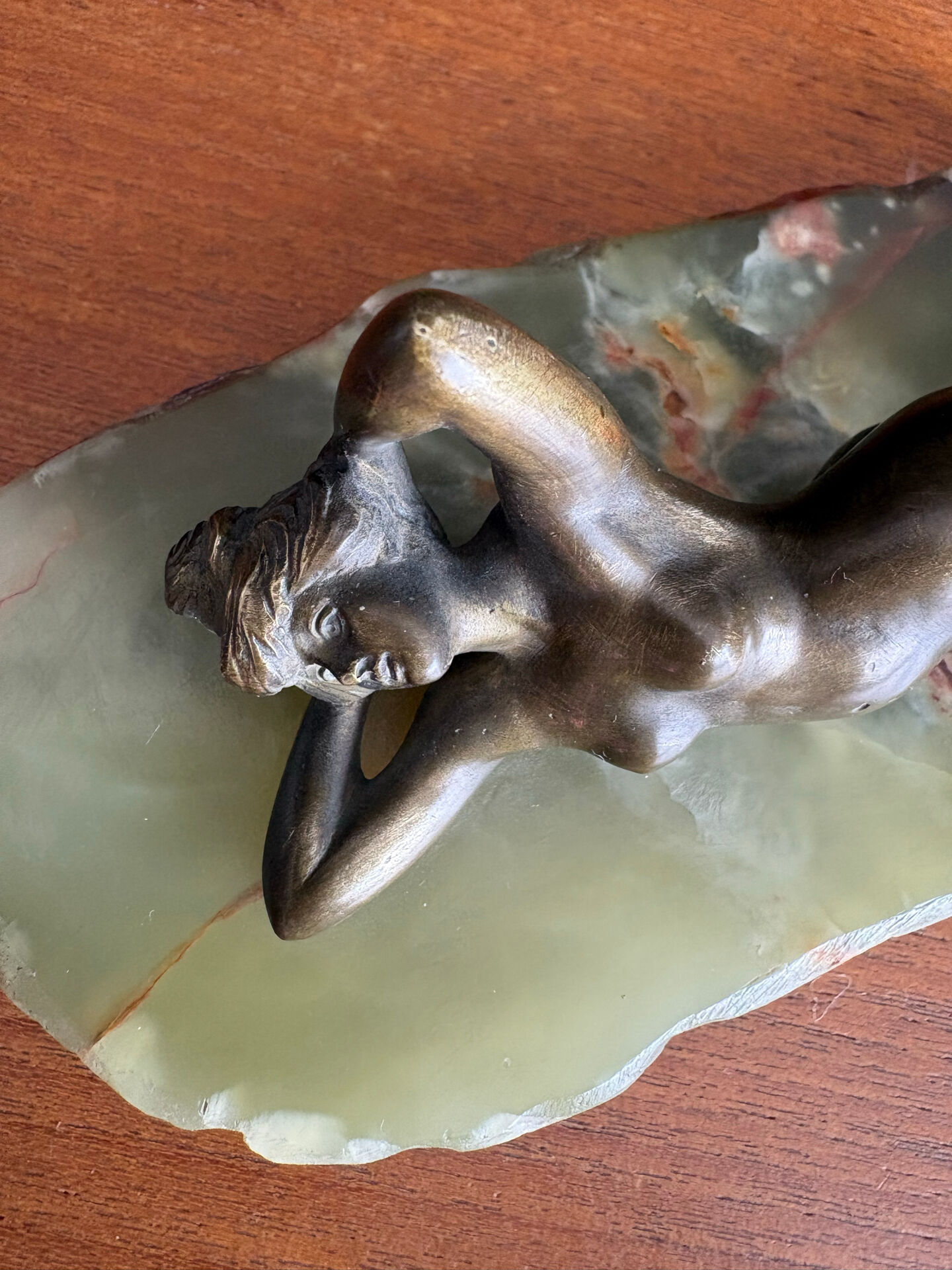 Art Deco female sculpture in bronze with onyx base.