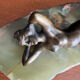Art Deco female sculpture in bronze with onyx base.