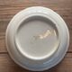 Plat rond creux en terre de fer HBCM