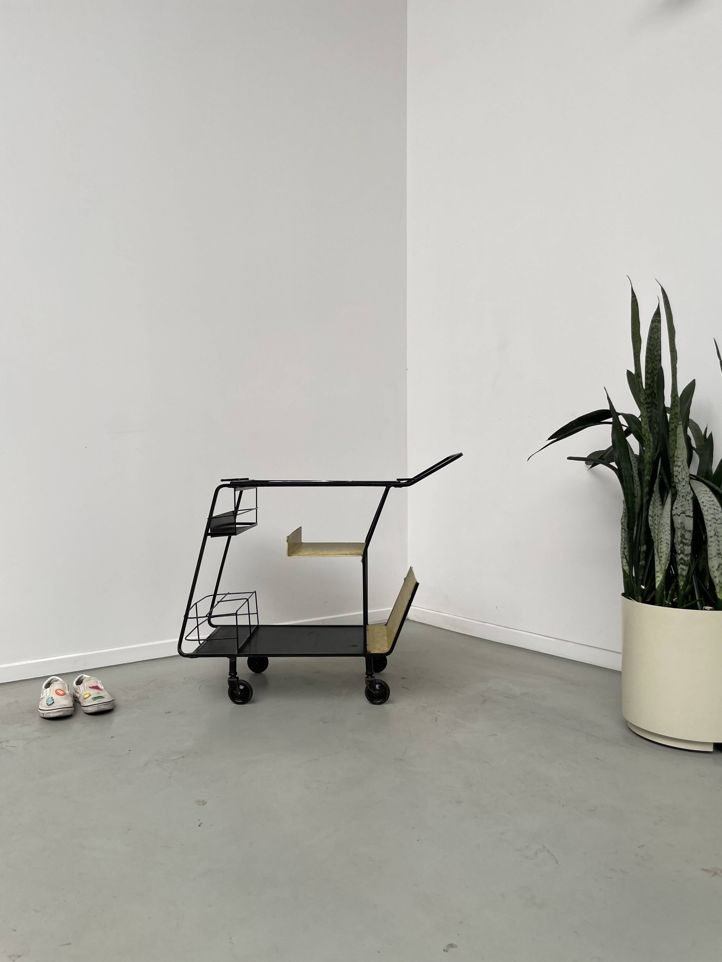 Perforated metal serving trolley in the Mathieu Matégot style