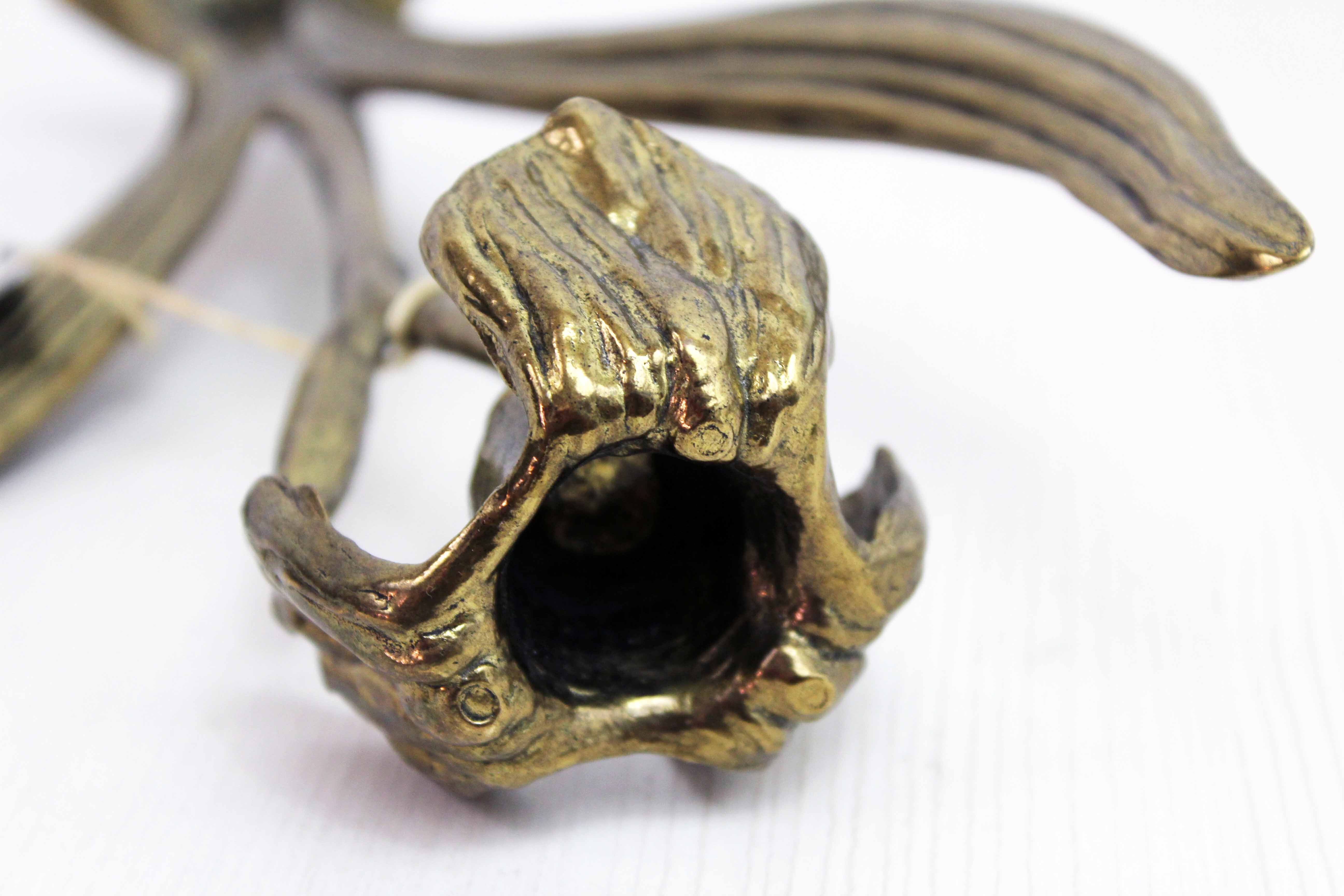 Art Nouveau brass flower candle holder