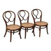 Set of three vintage bistro chairs in curved wood – Caned seat – Mismatched