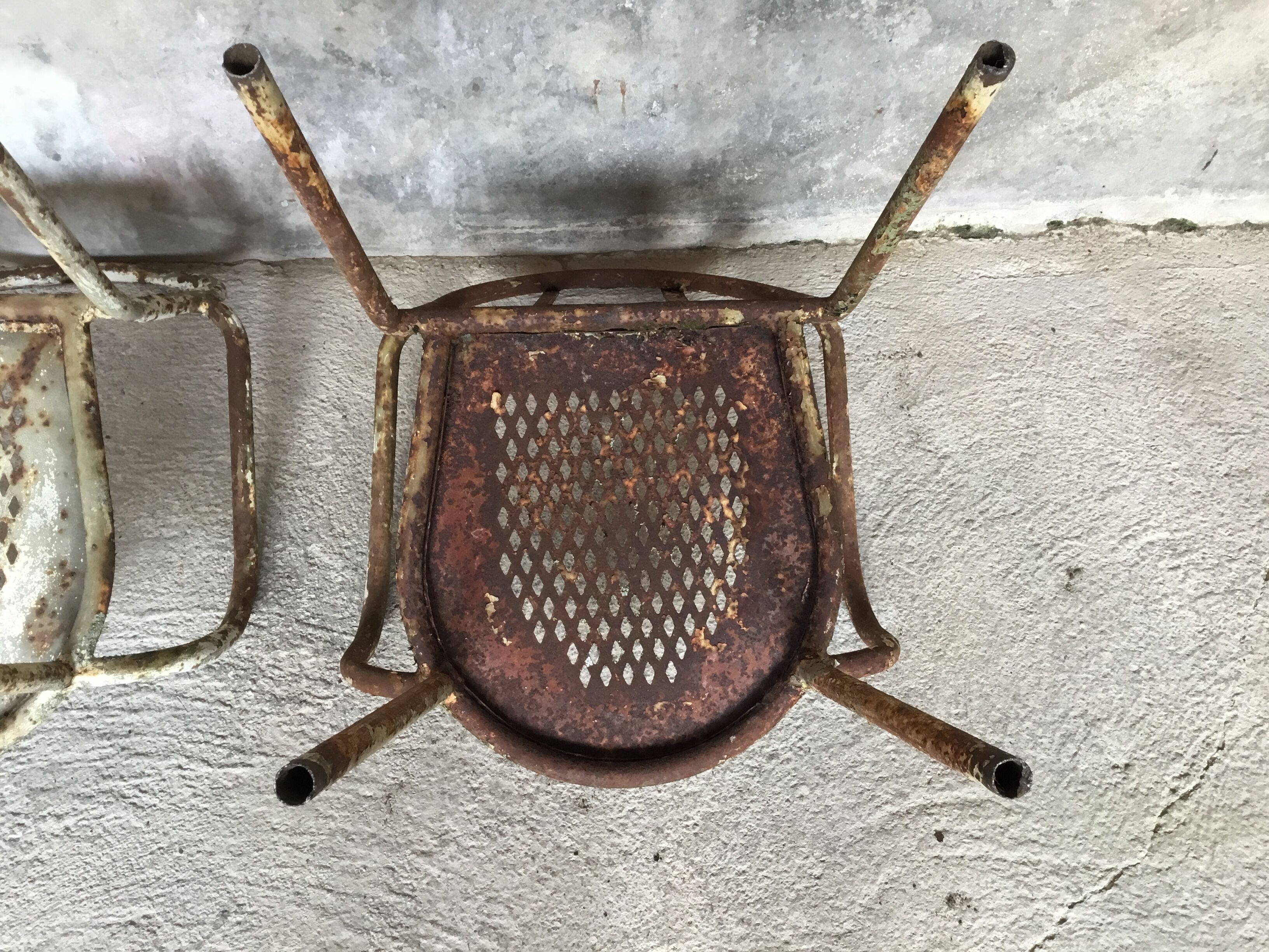 Pair of metal armchairs