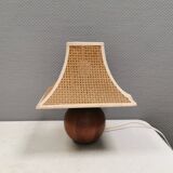 Very rare table lamp in turned teak wood with original braided shade. 1970s