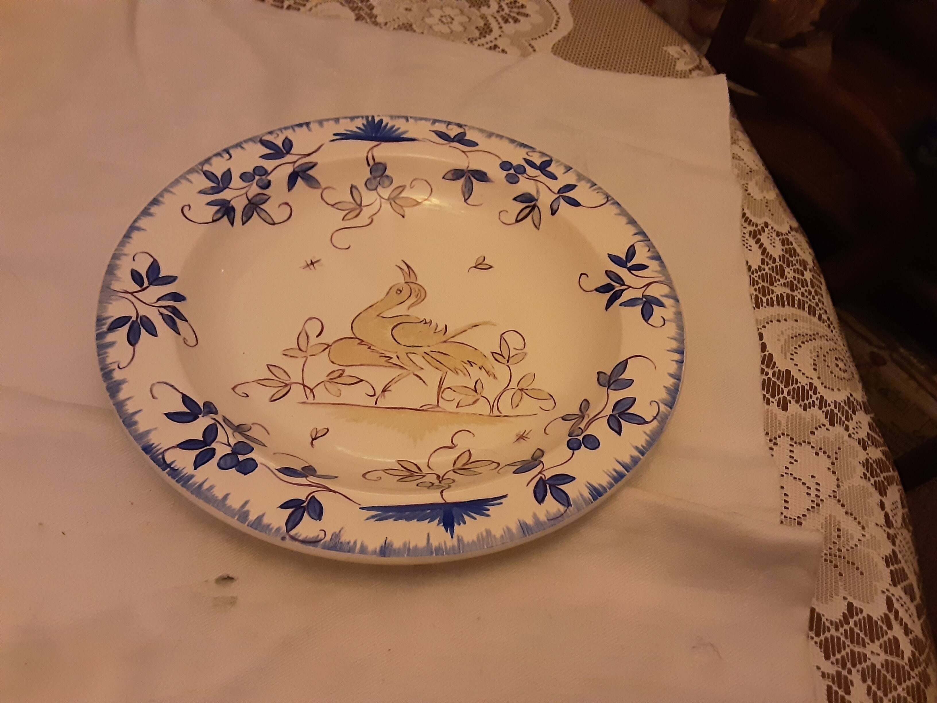 Deswarce hand-painted earthenware plate with moustier decor